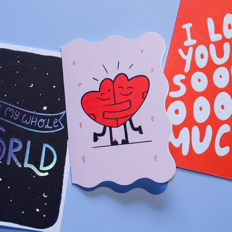 Three colorful greeting cards on a blue background