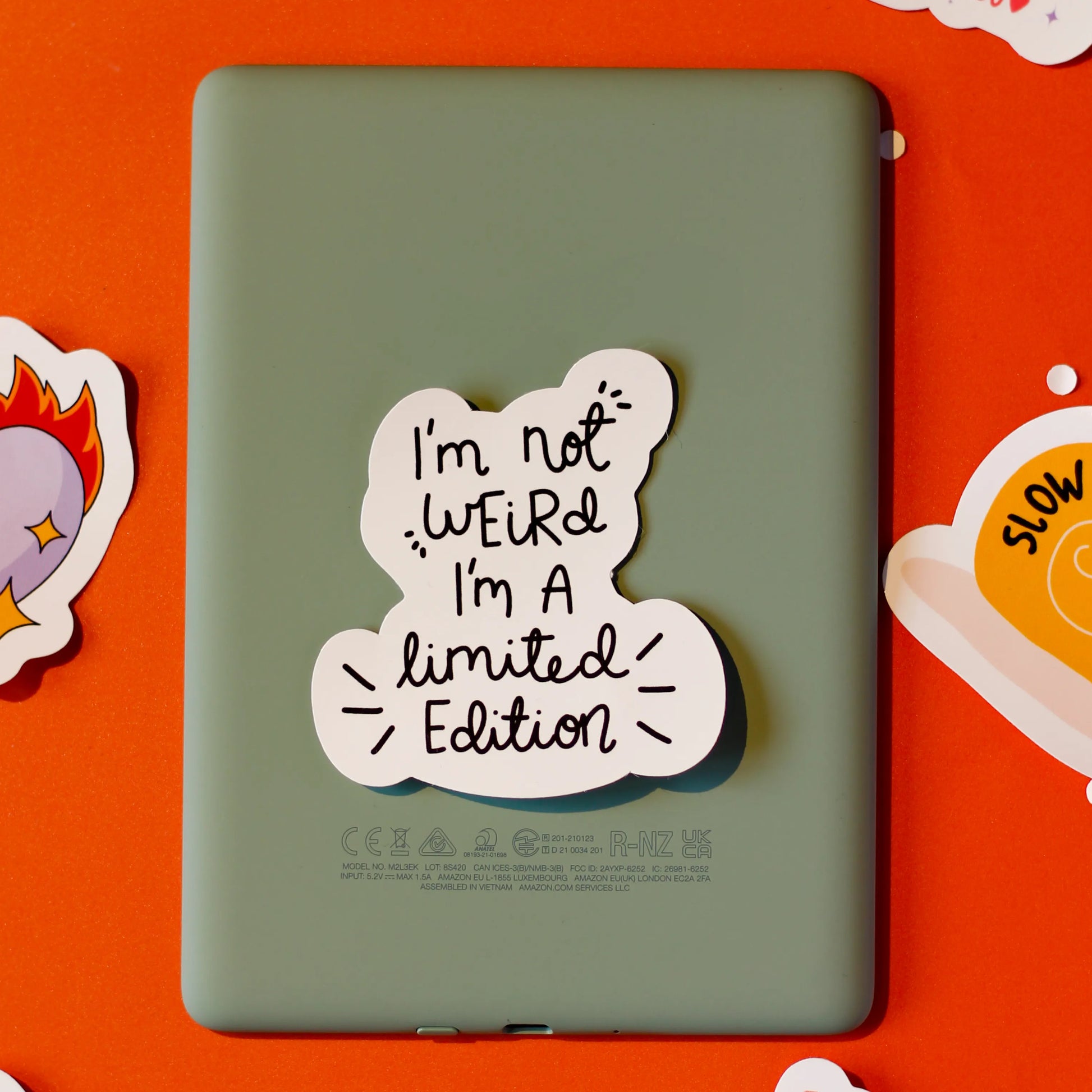 A 'I'm not Weird, I'm a limited Edition' sticker on an orange background.