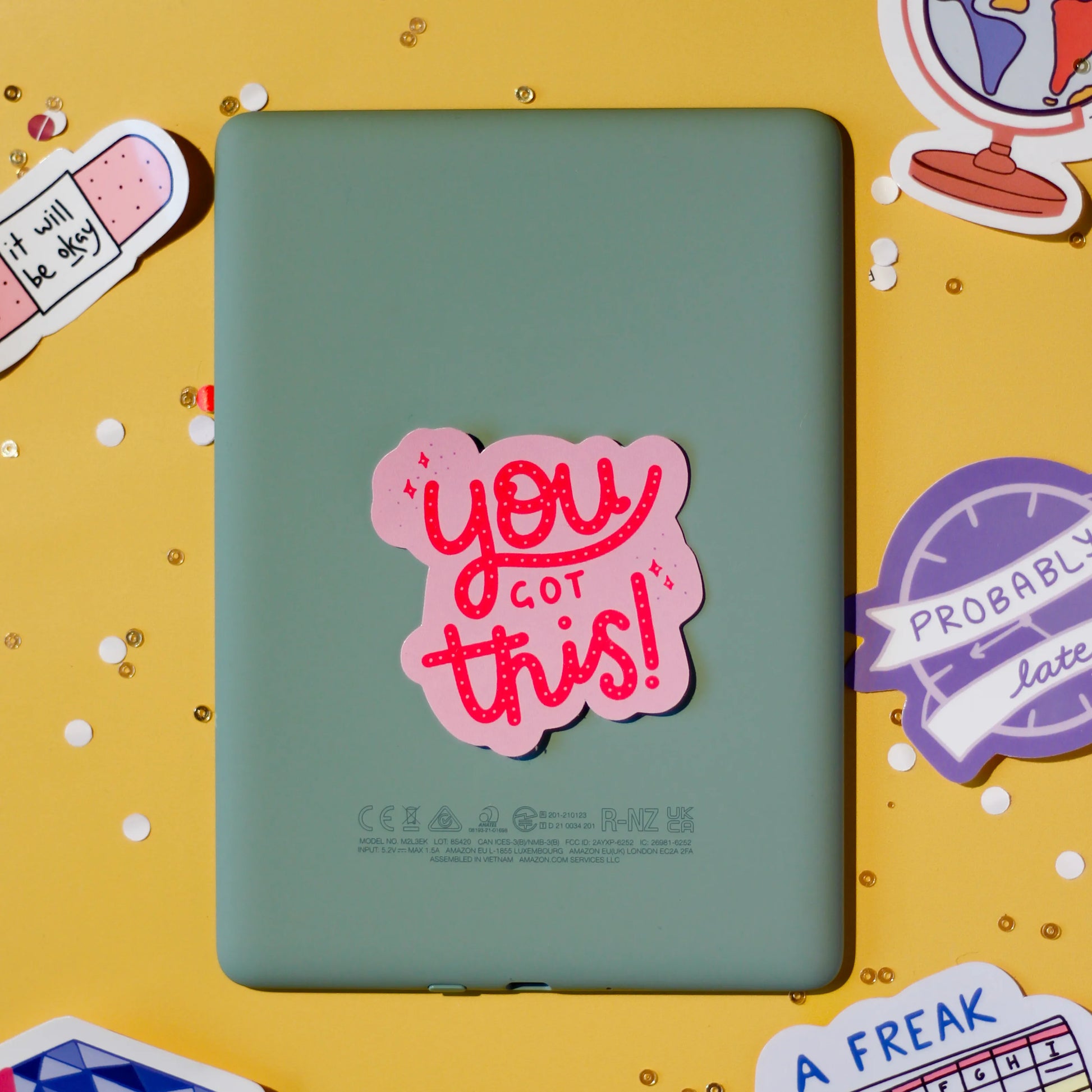 A pink 'You got this!' sticker on a yellow background.