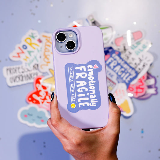 A phone case with 'Emotionally Fragile handle with care' sticker against a light blue background.