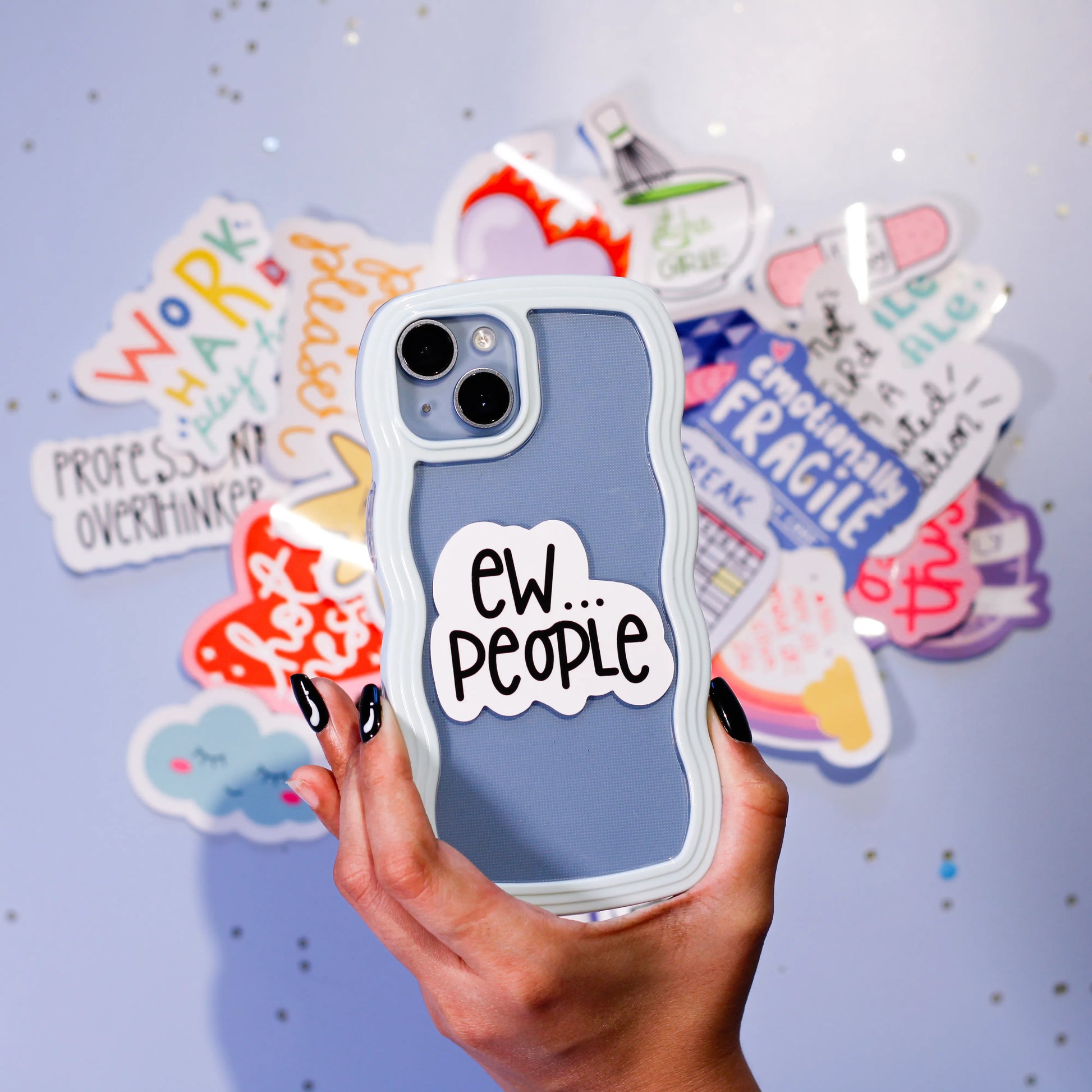 Phone case with 'EW... PEOPLE' sticker against a colorful background.