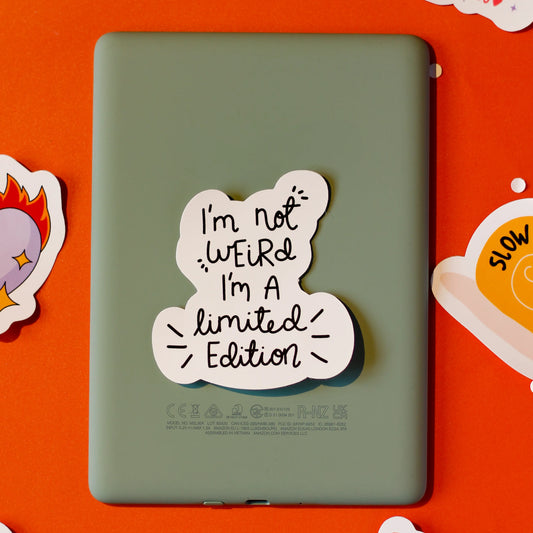  A 'I'm not Weird, I'm a limited Edition' sticker on an orange background.