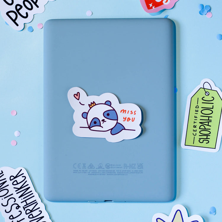 A 'miss you' on a light blue background.