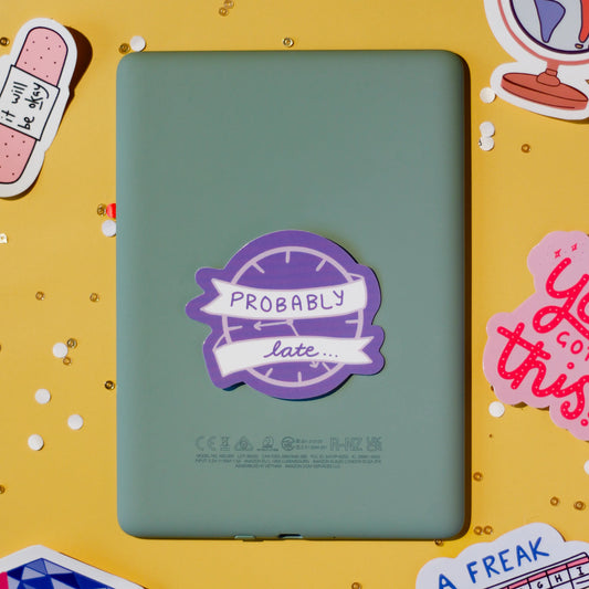 a purple 'Probably Late' sticker on a yellow background.