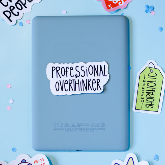 'Professional Overthinker' sticker on a light blue background with confetti.