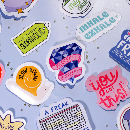 A collection of our cute stickers on a light blue background