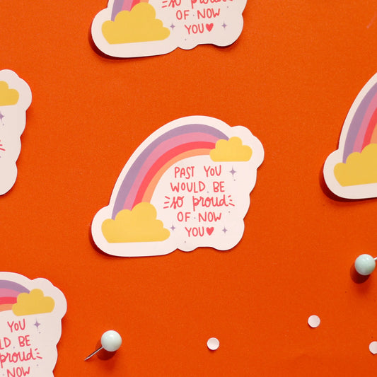 a close-up of 'Past You Would Be So Proud Of You' on an orange background.